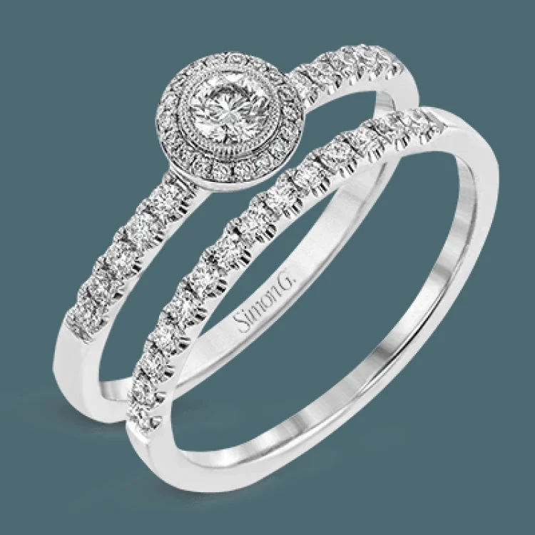 Women’s multi-stone engagement ring-These darling rings are perfect for many occasions- an engagement set, a birthday or graduation present, or a ‘just because' gift to yourself.A .16 ctw round diamond sits in the middle of the set, which has .31 ctw of white side diamonds.