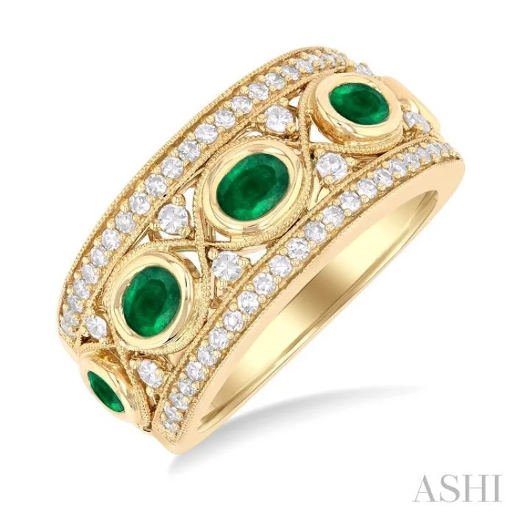 Women’s multi-stone engagement ring-4x3 MM Oval and 2.8 MM Round Cut Emerald and 3/8 ctw Curvy Criss-Cross Single Cut Diamond Precious Band in 14K Yellow Gold