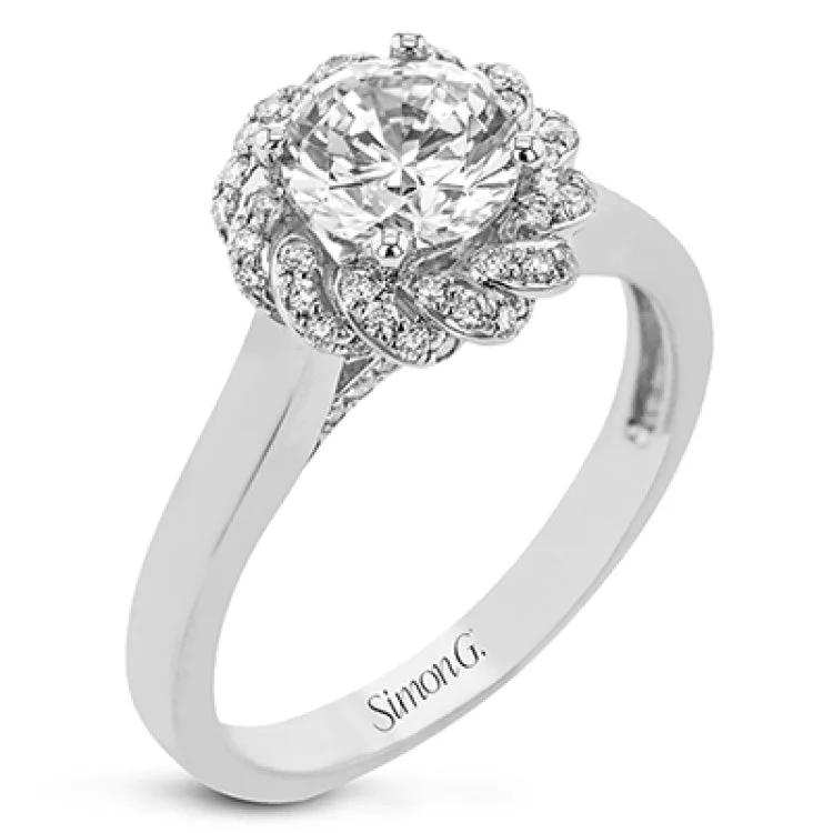 Women’s vintage engagement ring-An 18k engagement ring with a new take on the classic solitaire design, features a twisted diamond halo 0.31 ctw., and high polished yellow band