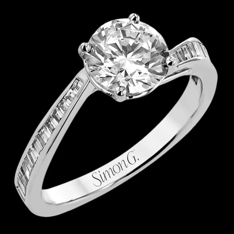 Women’s ethical engagement ring-This engagement ring in 18 kt white gold has a gentle curved band of sparkling baguettes 0.39 ctw.