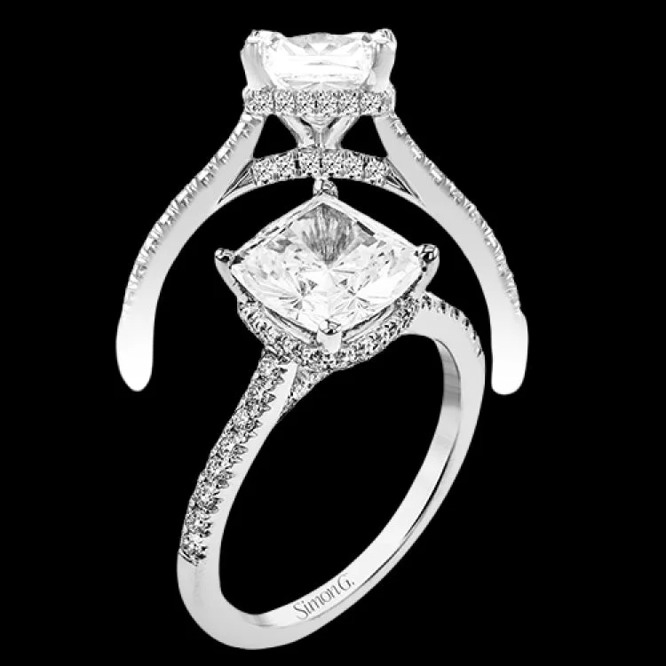 Women’s elegant solitaire engagement ring-This 18K engagement ring from our under halo collection evokes understated elegance, with 0.30 ctw of delicate diamonds on the shank, the lower halo, and the bridge.