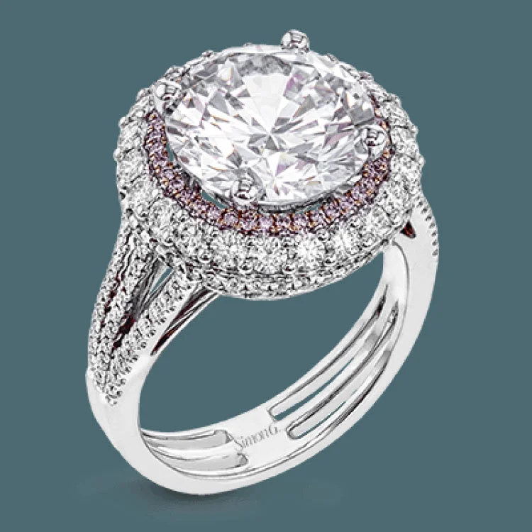 Women’s vintage diamond engagement ring-This 18k white and rose gold engagement ring is sure to turn heads with 1.09 ctw of white diamonds as well as .12 ctw of pink diamonds.