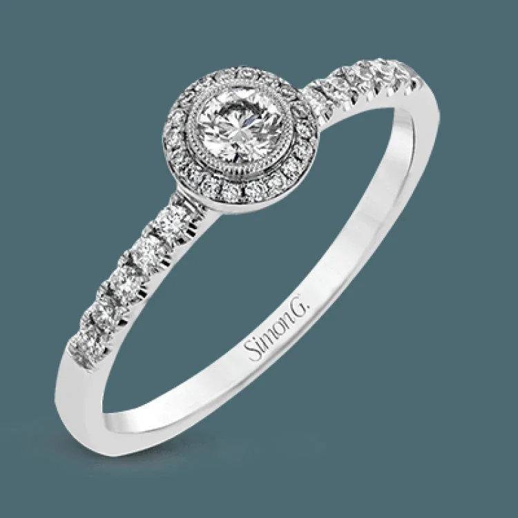 Women’s cushion-cut diamond engagement ring-These darling rings are perfect for many occasions- an engagement set, a birthday or graduation present, or a ‘just because' gift to yourself.A .16 ctw round diamond sits in the middle of the set, which has .31 ctw of white side diamonds.