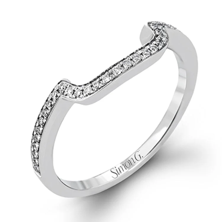 Women’s radiant diamond engagement ring-This vintage-inspired 18k white gold engagement ring is the perfect design for princess cut center stone because it has a detailed square shaped halo. The entire ring is set with .62 ctw of white diamonds.