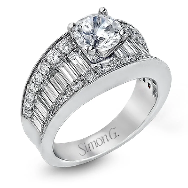 Women’s vintage diamond solitaire engagement ring-This eye-catching contemporary white gold engagement ring is accented by .75 ctw round cut white diamonds and 1.26 ctw baguette white diamonds for an unforgettable look.