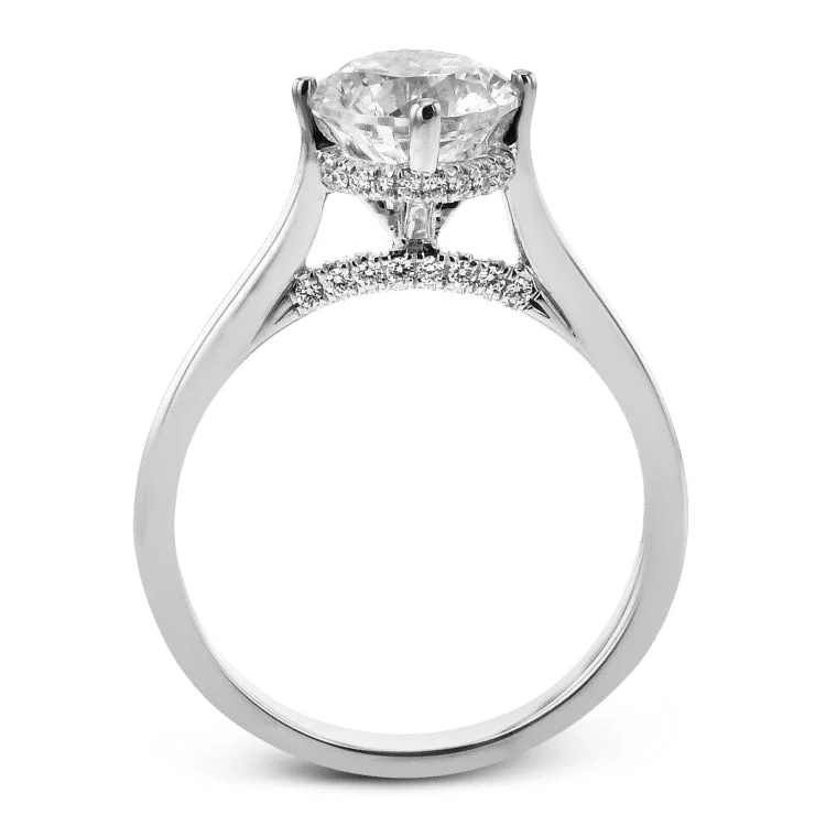 Women’s matching wedding band and engagement ring-This elegant white gold engagement ring takes a round center and is adorned with a delicate under halo, and a line of diamonds on the side profile 0.13 ctw